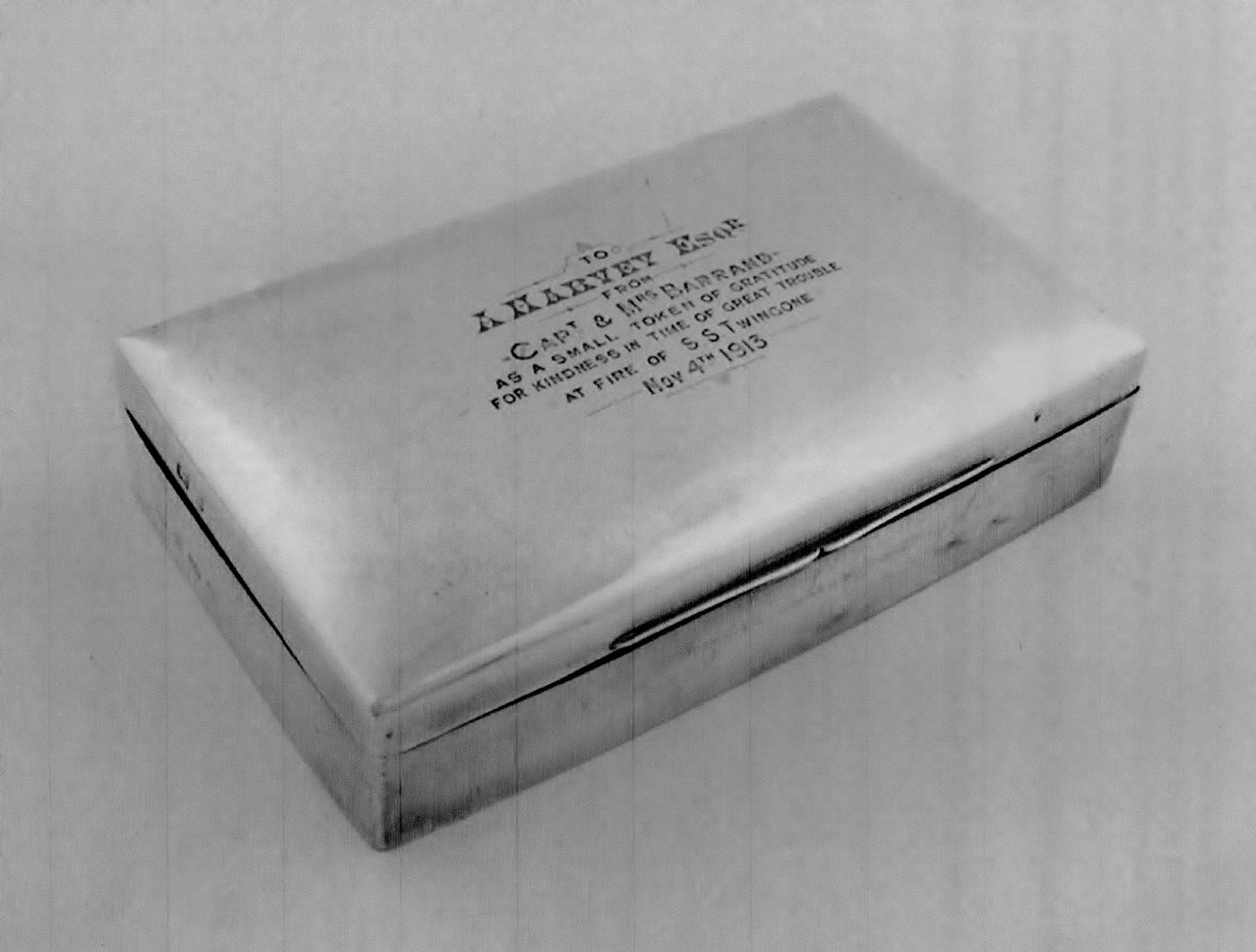 A presentation silver cigarette box, by William Hutton and Sons, Birmingham 1910,